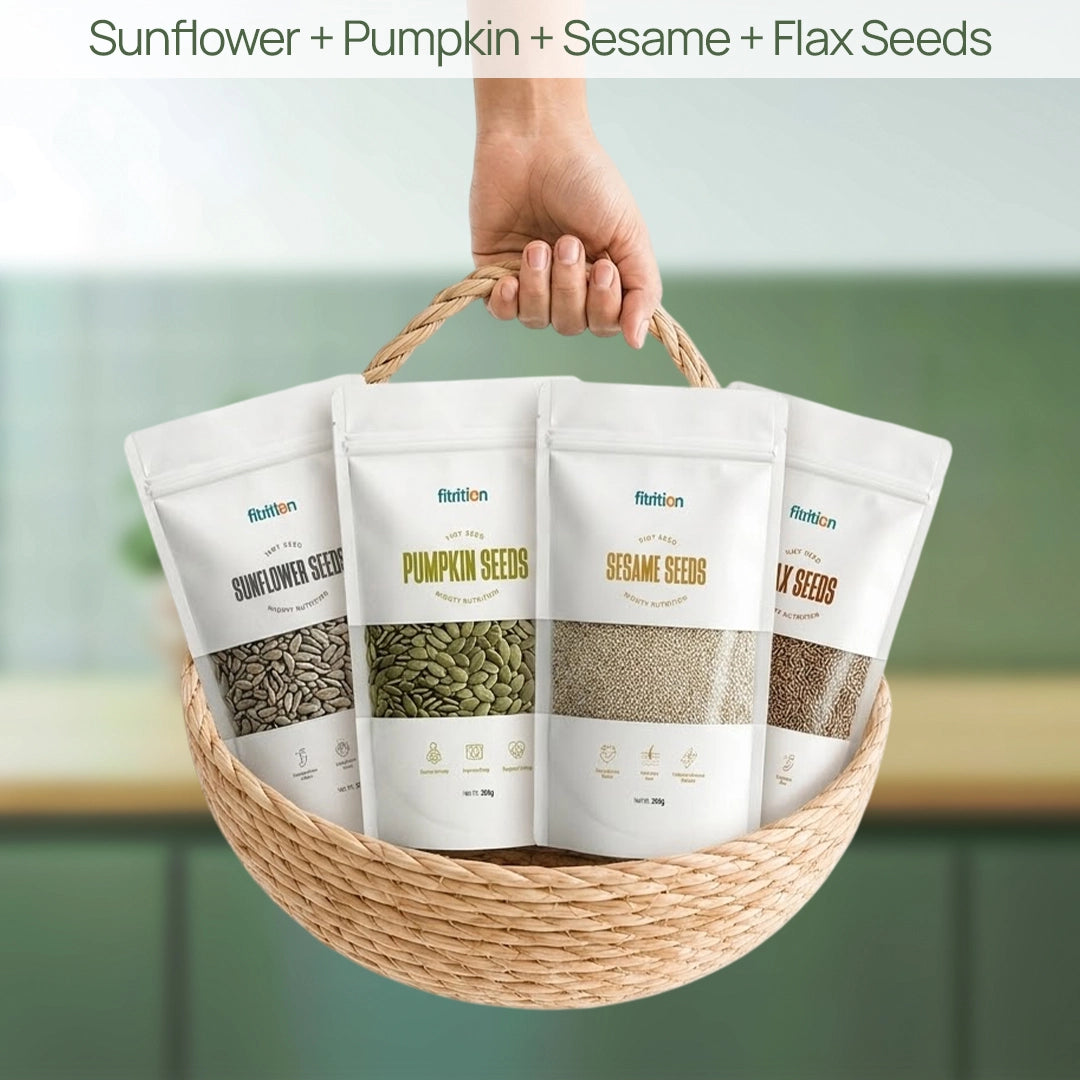 Basket with four packages of different seeds held by a hand against a blurred background